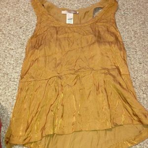 A gold glam shirt perfect for hot sunny days